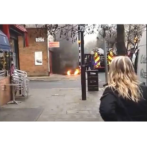 Pavement explodes into flames in front of shocked bystanders